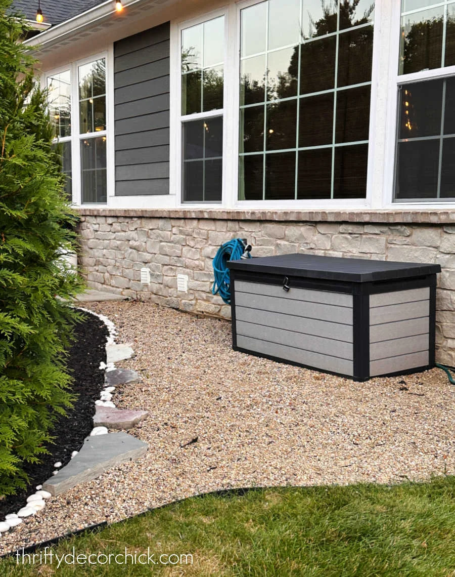 pea gravel area by spigot